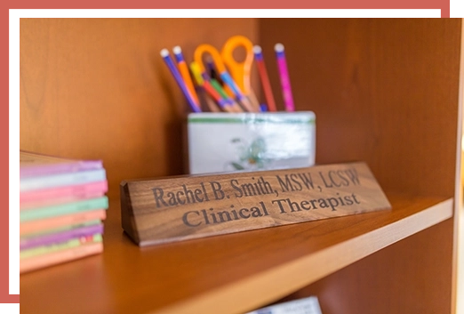 Rachel B. Smith clinical therapist nameplate on shelf.